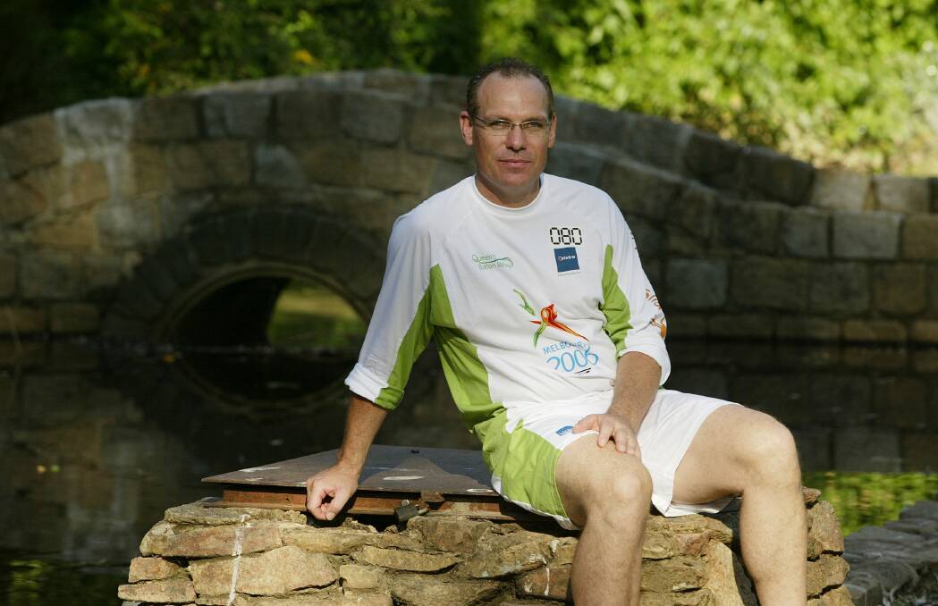 Favourite son: Dean Woods in Wangaratta's Merriwa Park at the time he carried the Queen's baton through the city as part of its journey for the 2006 Commonwealth Games. 