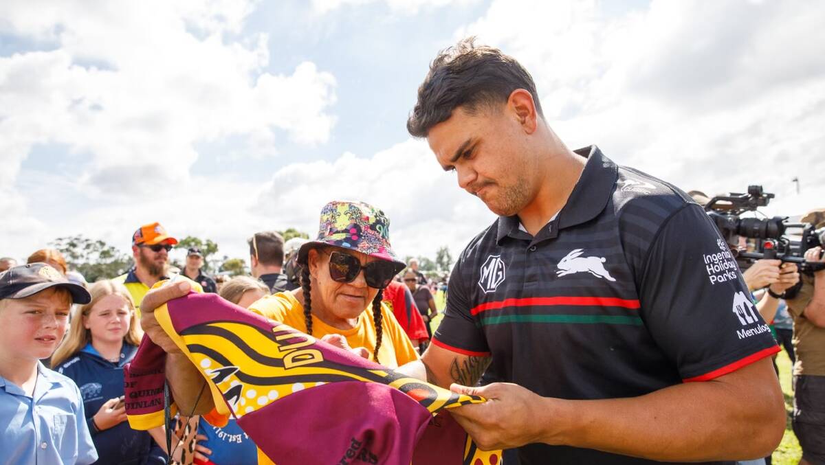 Rabbitohs star Latrell Mitchell was among some of the big name NRL players visiting Moree to help with Project Pathfinder launch on Wednesday, pictured signing jerseys and hats for fans. Picture by Simon Scott Photo