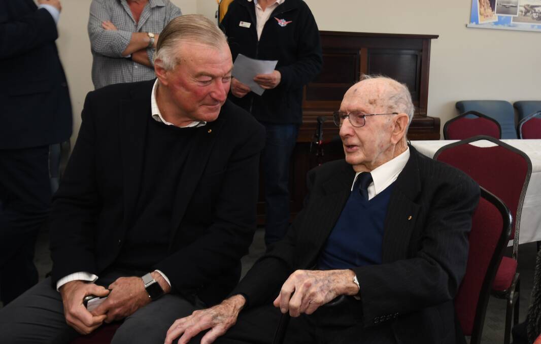 John Sharp and Max Hazelton share a word during the late aviation legend's 95th birthday celebration in 2022. Picture by Jude Keogh.
