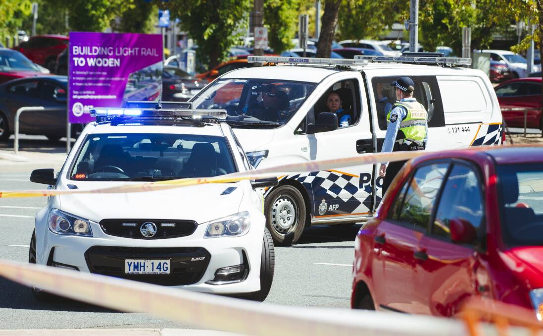 Firefighters and police respond to a car crash on the intersection of Northbourne Ave and London Circuit at Civic, Canberra. Picture: Dion Georgopoulos