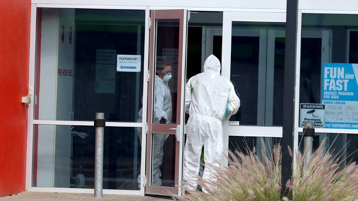 Cleaners at the The Denison Centre, in Adelaide, where there have been new cases. Picture: Getty Images