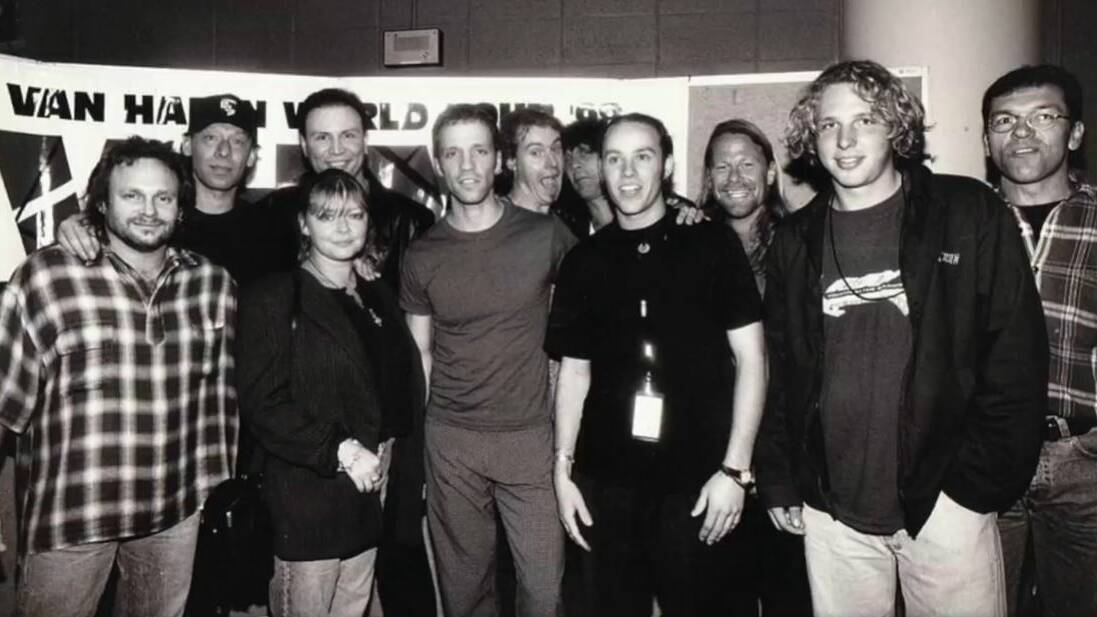 Steve Gray and Eddie Van Halen (back, middle) at a Sydney meet and greet during the 1998 Australian tour. Picture: Supplied.