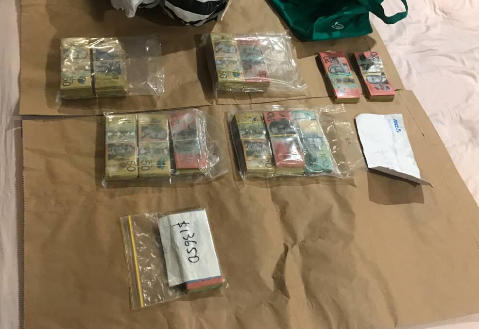 Police seized more than $100,000 cash suspected to be the proceeds of crime. Picture: ACT Policing