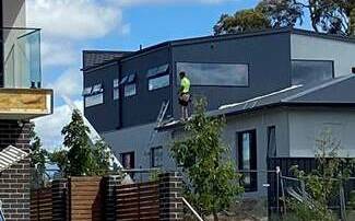 A construction worker was seen on a roof without safety equipment. Picture: WorkSafe ACT