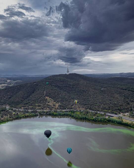 Hot air balloons fly over Lake Burley Griffin with blue-green algae Picture: Vishal Pandey