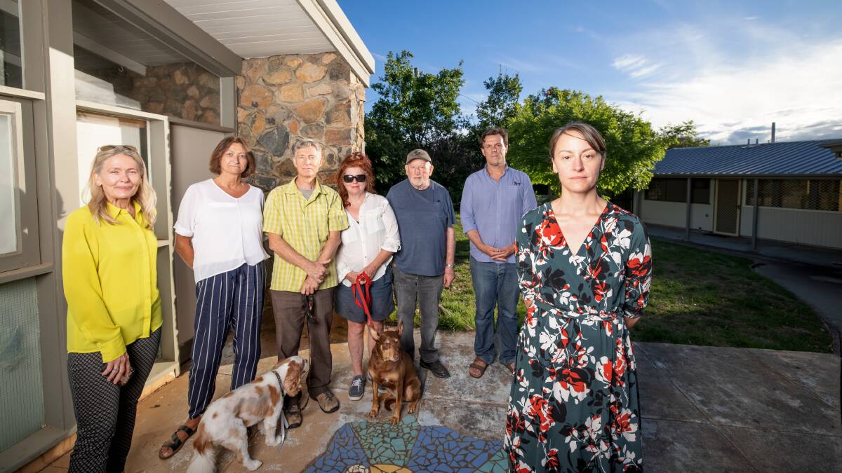 Ainslie residents Stephanie Kalish, Helen Kaye, Jeremy Allen, Ann Parry-Fielder, Len Mitchell, Adam Boyd, and Brooke Anderson are concerned about the YWCA's proposal to build supported accomodation on the Rutherford Crescent site. Picture: Sitthixay Ditthavong