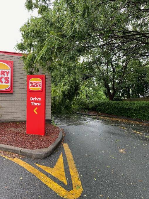 A tree fell onto the drive through at Hungry Jacks Queanbeyan causing some damage. Picture: SES Queanbeyan.