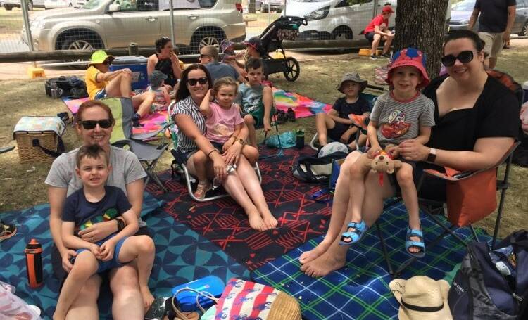 Jennifer and Rupert Larcombe, Elise and Sophie Aquilina and Emma and Harvey Cooper, enjoy a picnic at the Ankle Biters stage. Picture: Kathryn Lewis