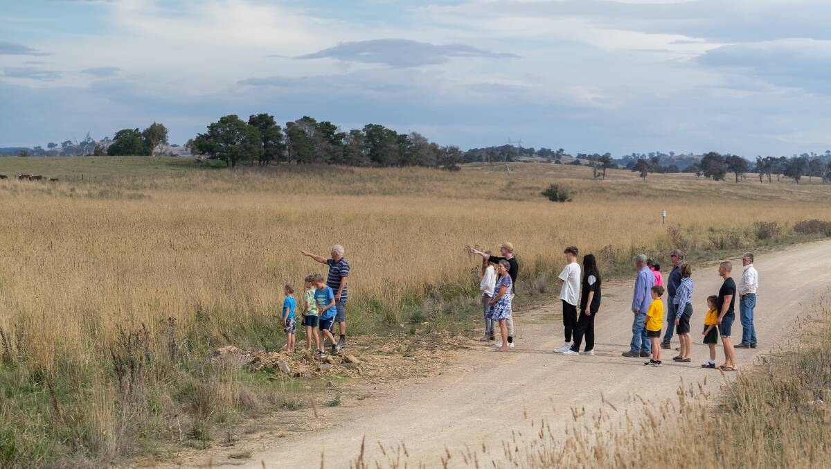 Concerned residents gather at the site of a proposed solar farm in Sutton. Picture: Richard Thompson