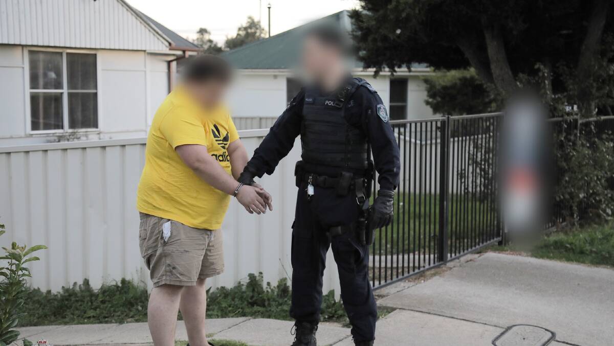 Police arrest a man as part of Strike Force Koombahla. Picture: NSW Police