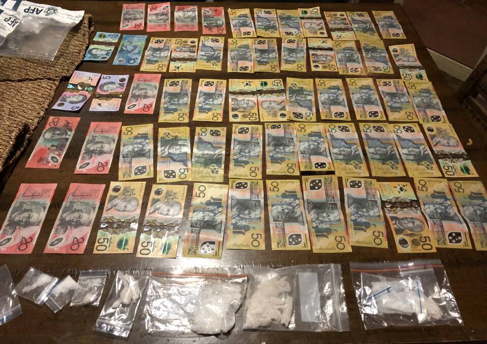 Cash and drugs seized by police following a search of a Ngunnawal home on Monday night. Picture: ACT Policing