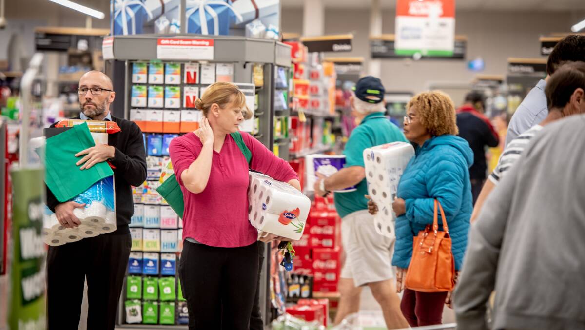 Most shoppers had at least one packet of toilet paper. Picture: Karleen Minney