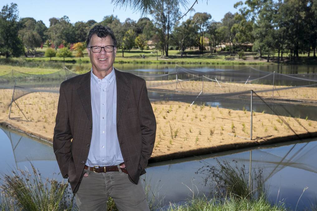 ACT Healthy Waterways program manager Ralph Ogden, next to new floating wetlands for Lake Tuggeranong. Picture: Keegan Carroll