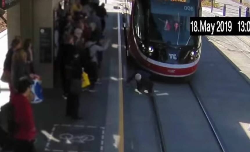 A man was seen in the video falling onto the tracks in front of the tram as it pulled into the station. Picture: Facebook