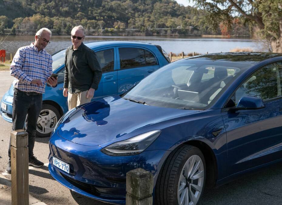 Karl Goiser (right) who has the first registered EV in the ACT and Peter McNeil (left) who had the 1000th. Picture: Supplied