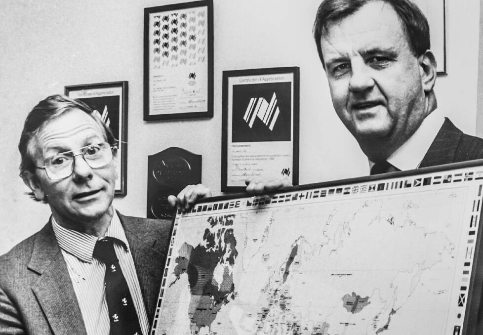 Former Canberra Times editor Ian Mathews with Don Thomas of Canberra City Rotary club with a PolioPlus world map printed by The Canberra Times.