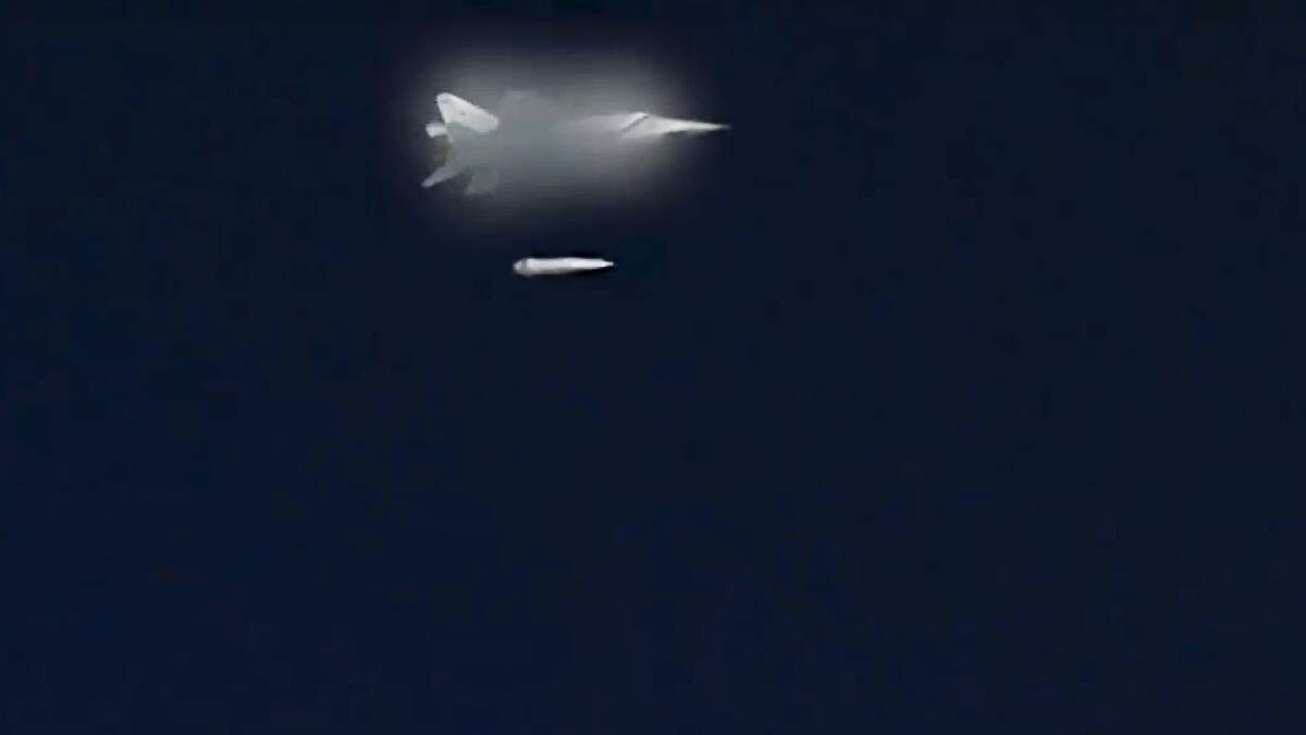 A still image from a Russian Defense Ministry video showing a Russian MiG-31 fighter jet launching a Kinzhal hypersonic missile during a test. 