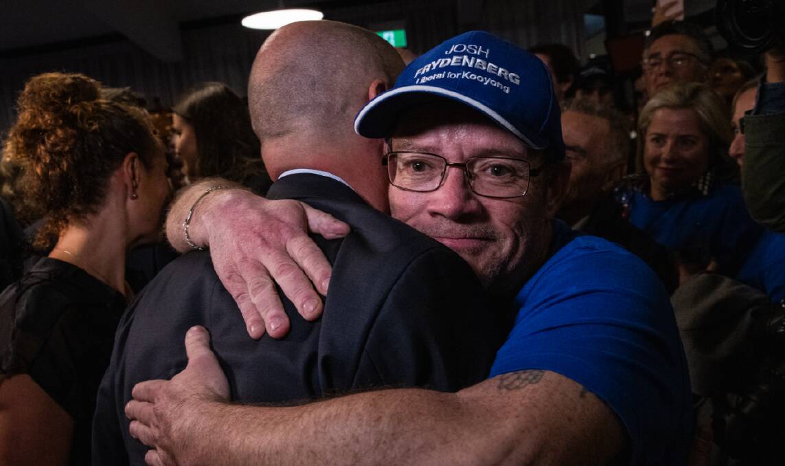 A supporter hugs Josh Frydenberg, part of a Liberal Party thrashed at the election. Picture: AAP