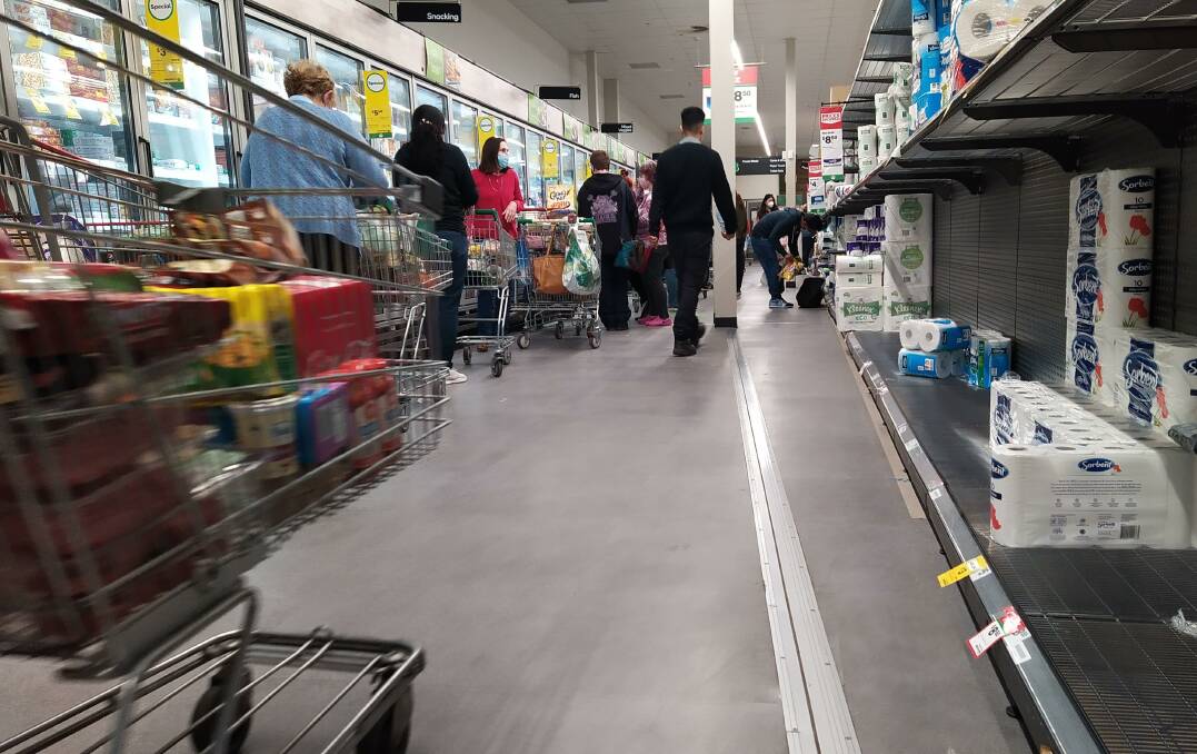 Anxious shoppers rushed to supermarkets for toilet paper and other essentials.