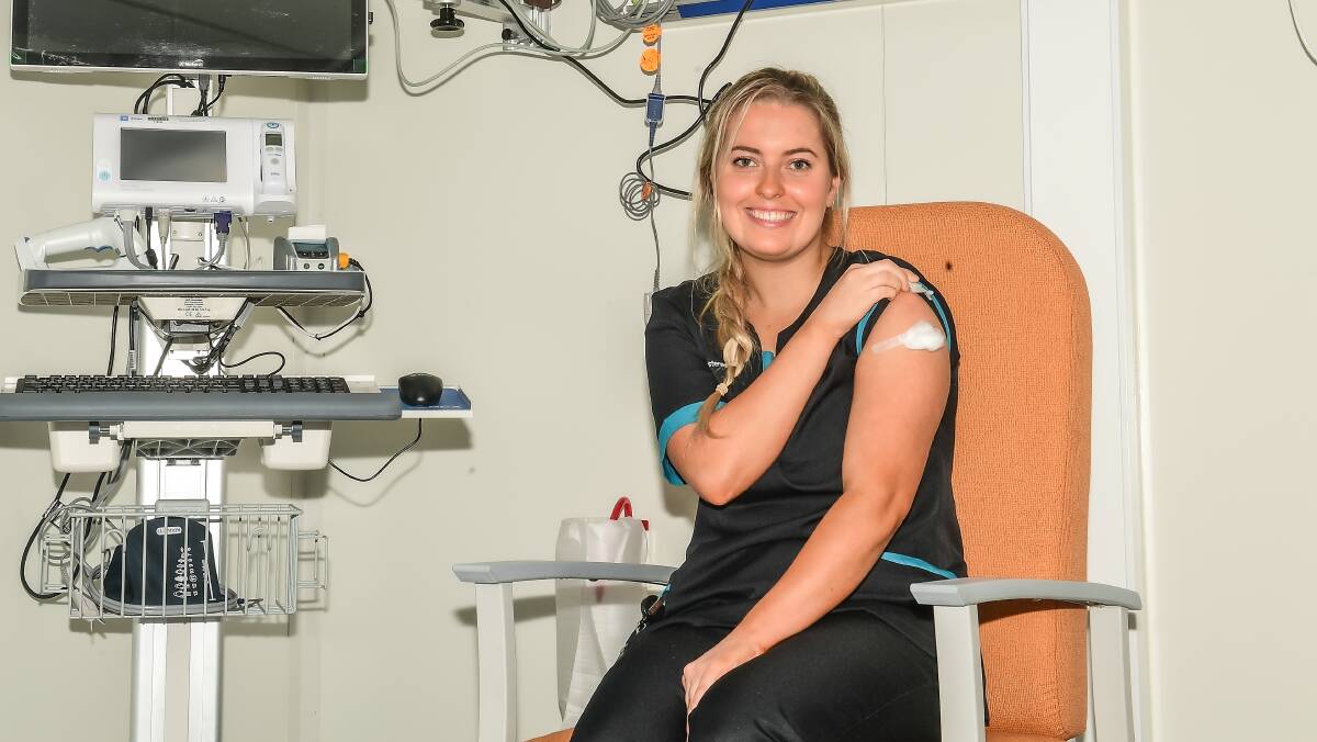 Canberra nurse Maddy Williams after receiving a vaccine. Picture: Karleen Minney