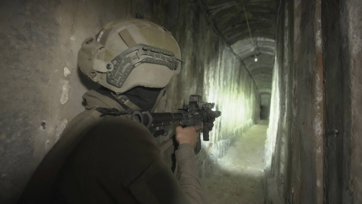 An Israeli soldier shows media an underground tunnel found underneath Shifa Hospital in Gaza City. Picture AP