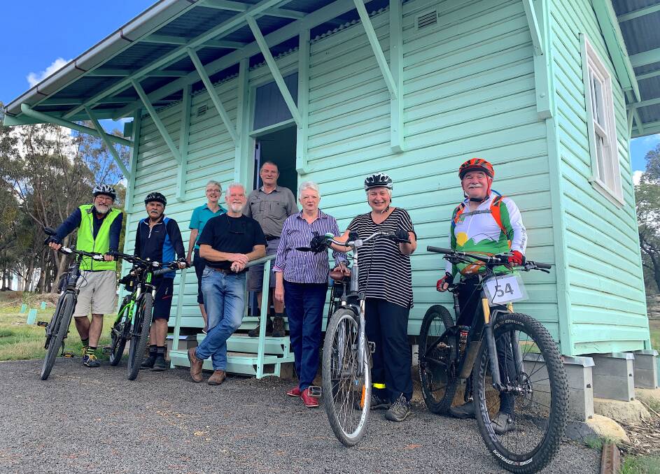 Tumbarumba locals Malcolm Marshall, Peter McDade, Cathy Fitzgerald, Ron Frew, Owen Fitzgerald, Cathy Frew, MaryAnn Marshall and Martin Brown outside the old Barracks at the Tumbarumba end of the rail trail. Picture: Tim the Yowie Man