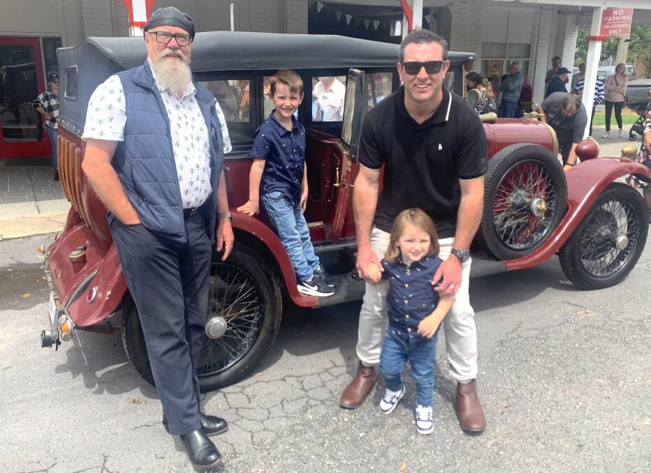 Bailey's Garage owner Craig Southwell with Cam Gilbey and his sons Noah, 6, and Kodah, 2. Picture: Dave Moore