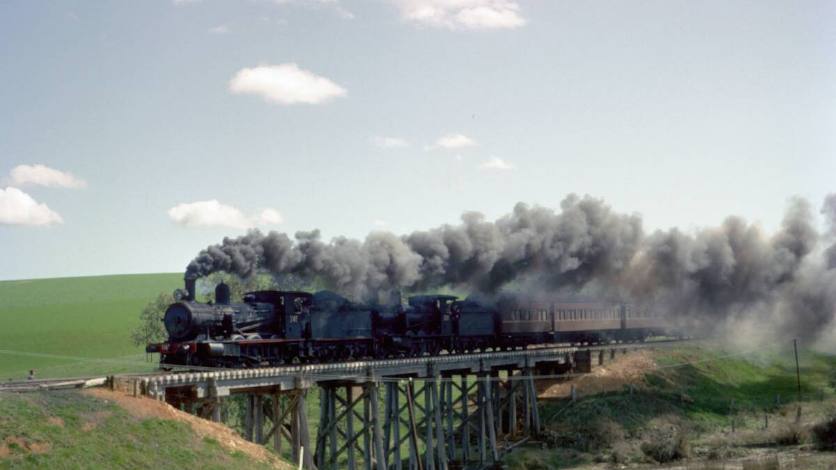 Locomotives 3142T and 3020T cross the 7-span bridge over Mannus Creek near Wolseley Park, on the Rosewood to Tumbarumba line, in September 1965. Picture: Australian Railway Historical Society - NSW and NJ Simons