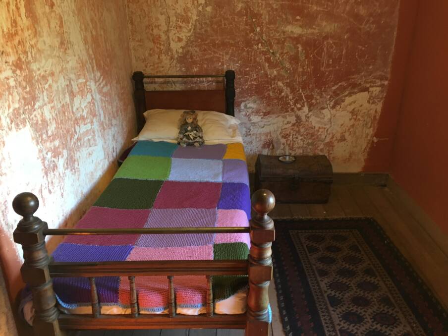 One of the small bedrooms at Cooma Cottage, complete with historic graffiti on the walls. Picture: Tim the Yowie Man