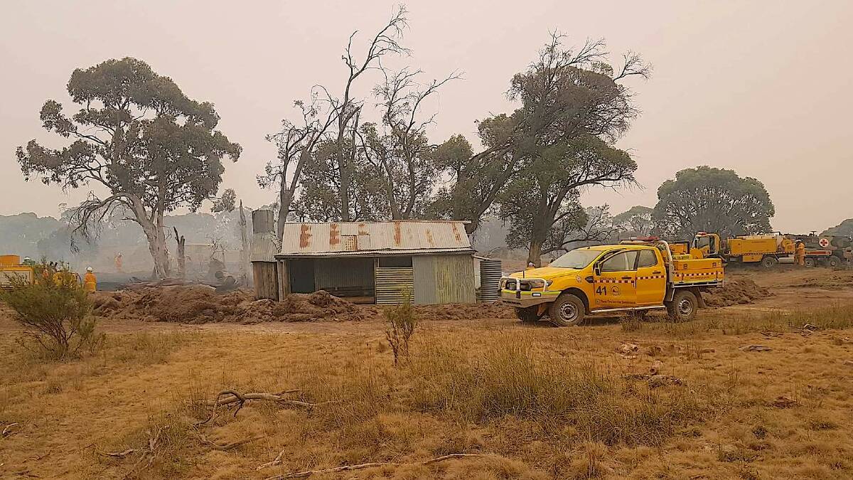 Fire crews secure Waterhole Hut in southern Namadgi National Park. Picture: QFES Strike Team Alpha Delta