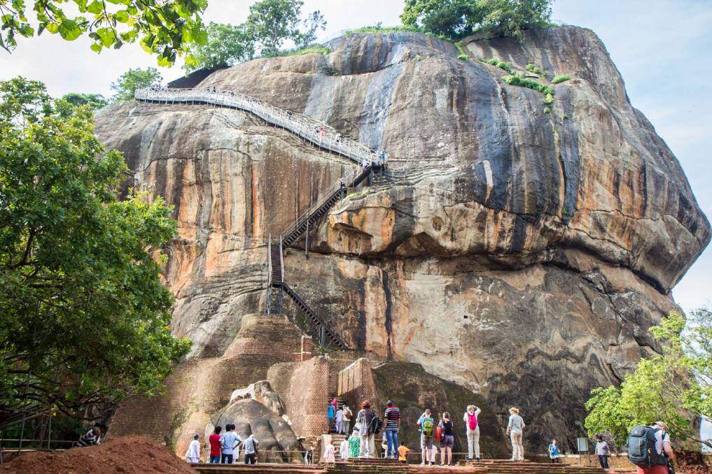 Sri Lankans pay the equivalent of 30 cents to climb the imposing rock of Sigiriya while foreigners pay about US$30. Pictures: Michael Turtle