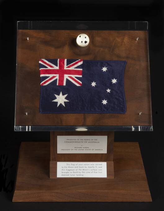 Fragments of moon rock collected during the Apollo 11 mission in 1969 with an Australian flag that went to the moon and back. Picture: NAA A4061