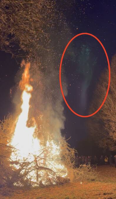 The unusual green spectre captured in photos during a bonfire on private property on the shores of Lake George. Picture by Scott Mitchell