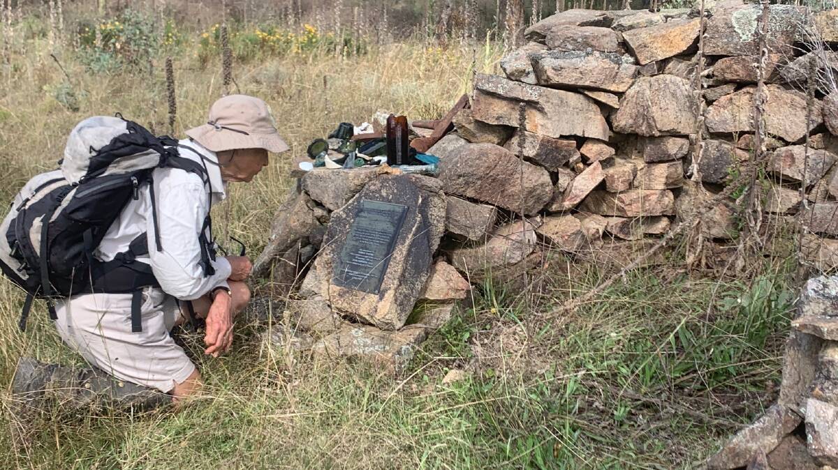 Jenny Horsfield inspects the memorial to workers at the former Melrose Valley Railway Camp Fireplace. Picture: Tim the Yowie Man