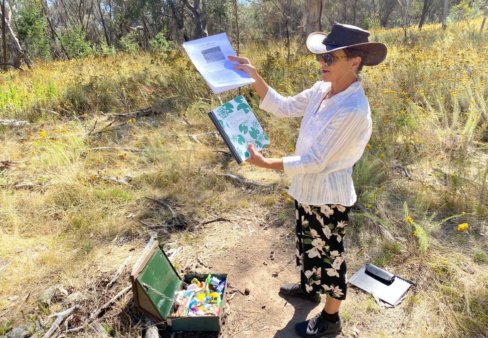 Julie Rickwood replaces the visitors book and information sheet. Picture by Tim the Yowie Man