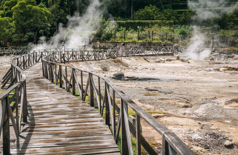 Steam rises from Caldeira Velha's volcanically hot springs.