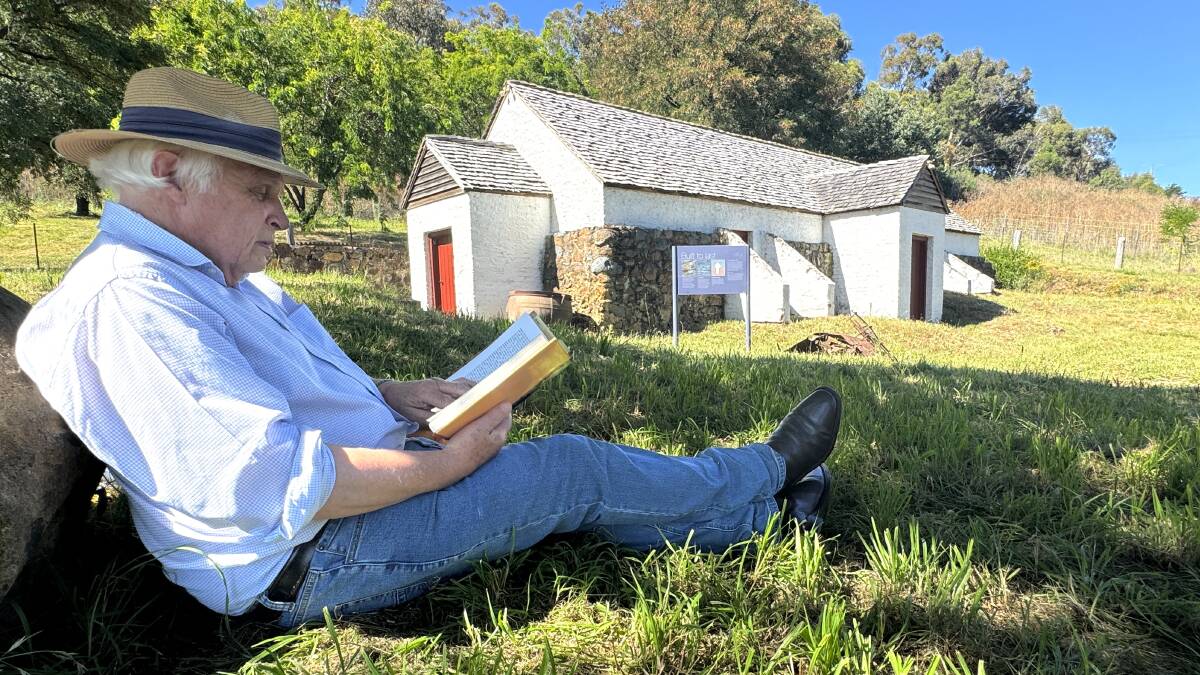 History buff Ian Burke reads the diary of explorer Dr John Lhotsky who visited the dairy in 1834. Picture by Tim the Yowie Man