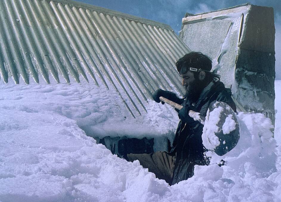 Chris Pavich digs out the entrance door to Tin Hut in 1975. Picture: Klaus Hueneke