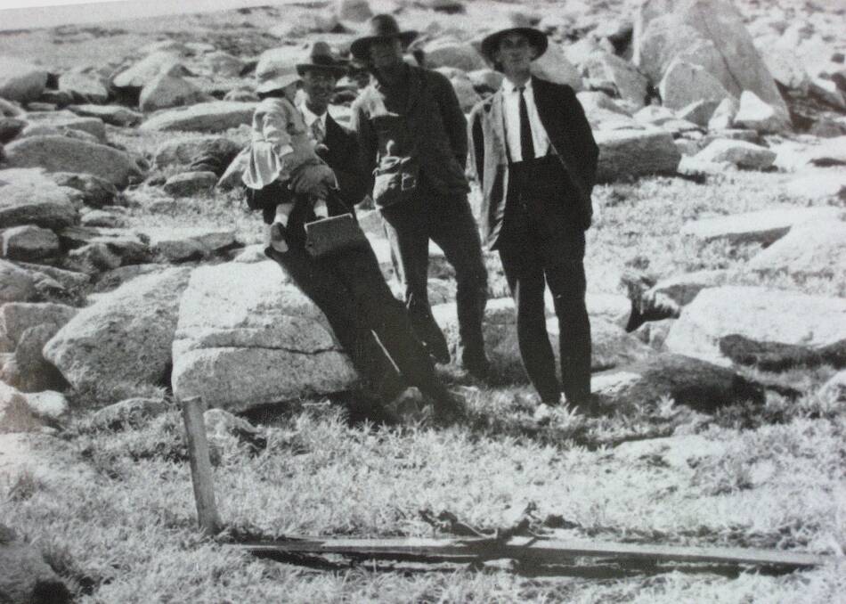 Long after his remains were removed, Evan Hayes's skis were left at the site he was found. Jack Willis who found Evan Hayes' body is at centre. Picture: Henry Willis Collection