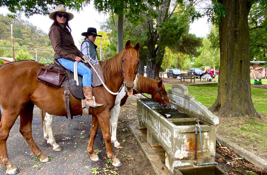 Jo Brissenden (on Copper) and her niece Claire Hall (on Pippi) water their horses at the Captains Flat trough. Picture by Tim the Yowie Man
