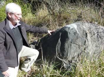Dr Doug Finlayson at the limestone outcrop on Acton Peninsula when it was accessible to the public. Picture by Tim the Yowie Man