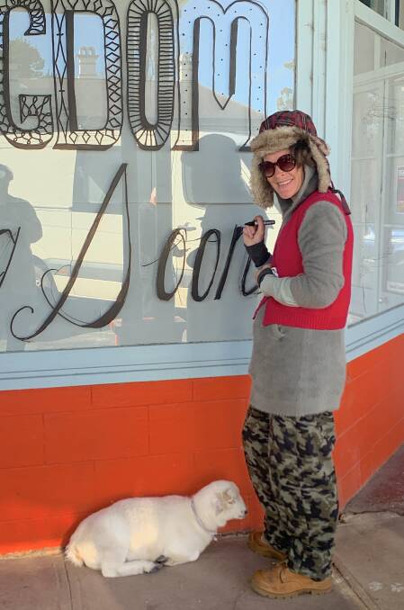 Melanie Cansell and her pet sheep greet passers-by in the main street. Picture: Tim the Yowie Man