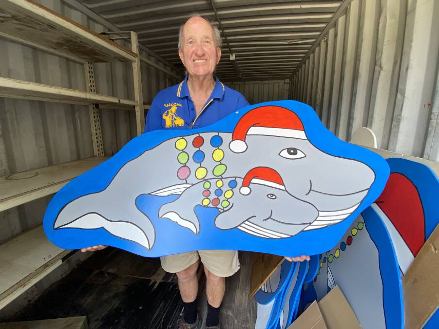 Narooma Men's Shed president David Trickett with one of the festive season-inspired whale signs made by members. Picture by Tim the Yowie Man