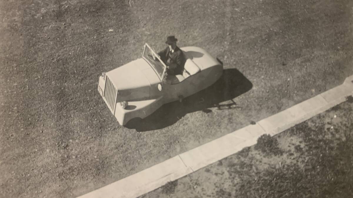 Sir Roland Wilson drives his homemade electric car around Canberra circa 1943. Picture: Sir Roland Wilson's Personal Papers, NLA