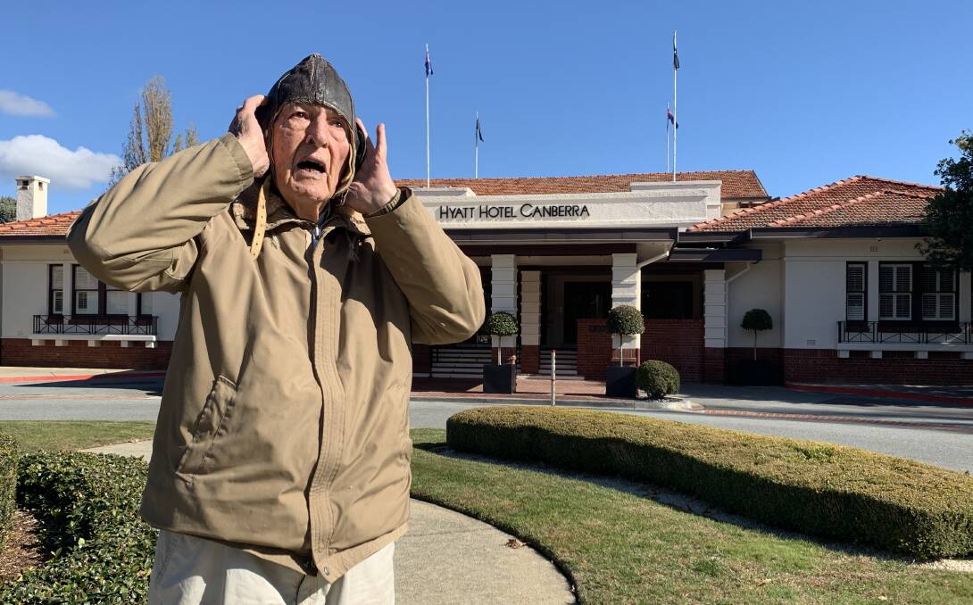 Stan Goodhew in a World War II vintage flying helmet reminisces about the day in 1942 that a B25 flew through the flagpoles atop the Hyatt Hotel. Picture: Tim the Yowie Man