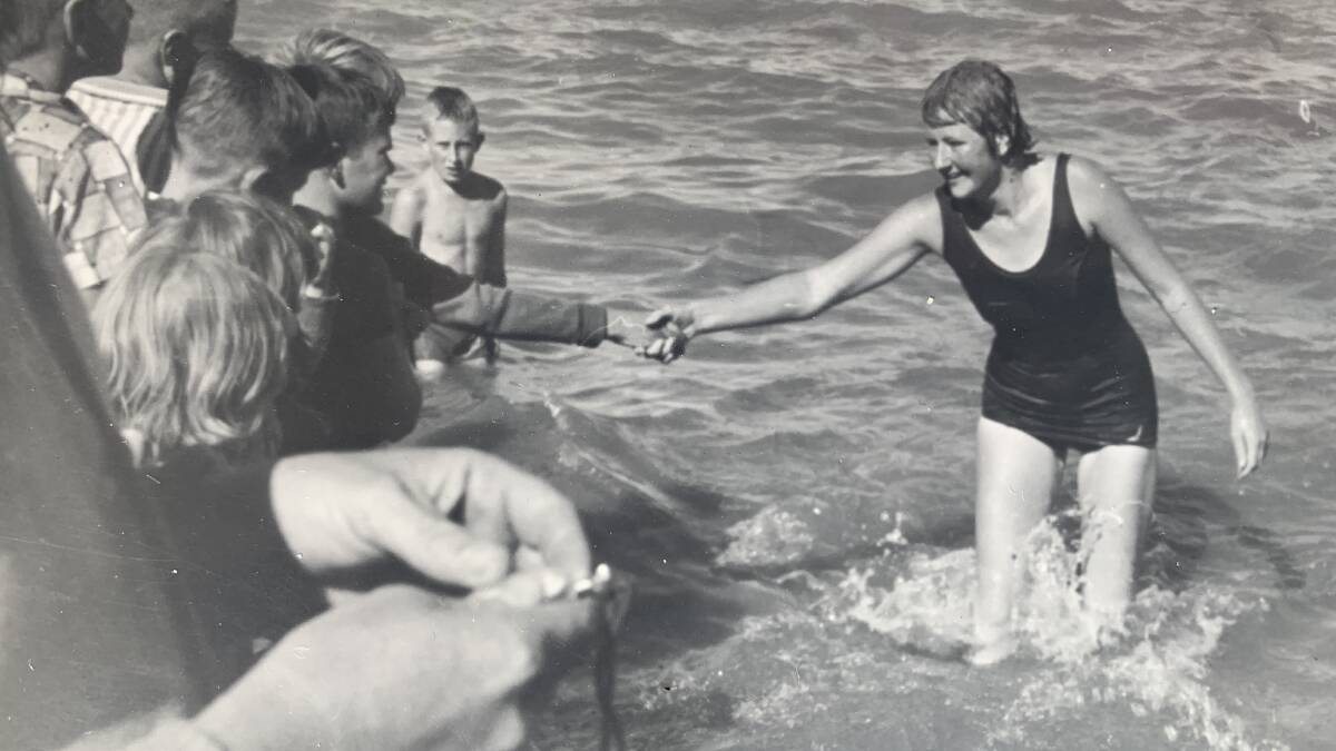 Julia Laybutt emerges from the water after the first Lake George marathon swim on March 12, 1961. Picture courtesy of Julia Laybutt