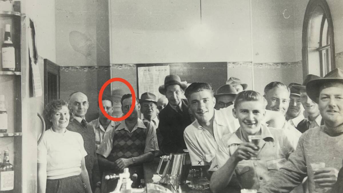 The photograph featuring a phantom figure at the Royal Hotel in Bungendore. Gordon McKie is at the right, his elbow on the bar. Picture courtesy of Graeme McKie