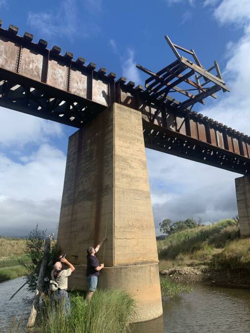 David Hanzl and his mate, Simon, investigate the underside of the Foxlow Bridge. Picture: Tim the Yowie Man