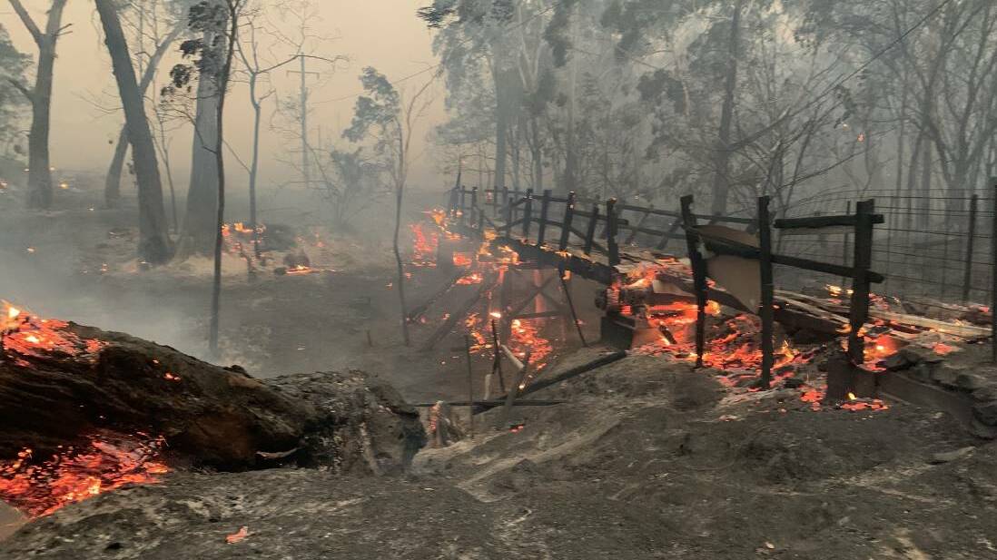 The Nerriga Footbridge in flames. Picture: Carwoola RFS