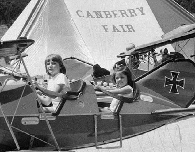 Heather Carter of Randwick and Rebecca Johnston of Reid try the Red Baron aircraft ride in 1986. Picture: ACT Heritage Library/The Canberra Times